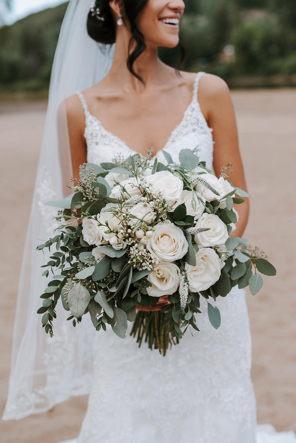 Portrait of a bride holding a wedding bouquet.